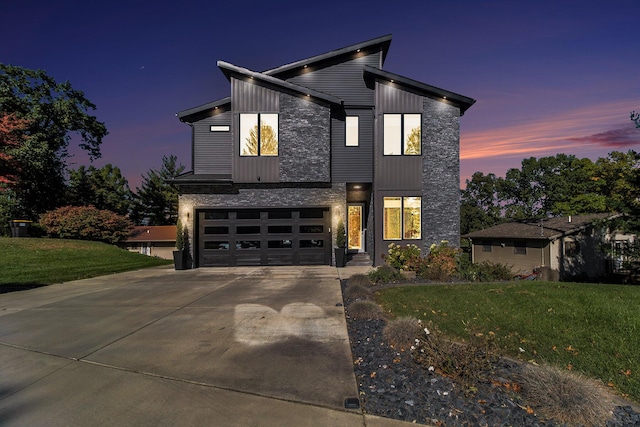 104 Highview Ct, Brooklyn, MI 49230 - contemporary house with driveway, a garage, and a lawn