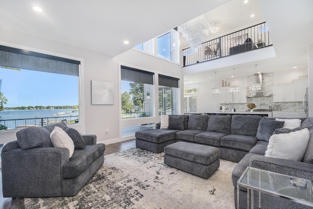 104 Highview Ct, Brooklyn, MI 49230 - living room with wood finished floors, recessed lighting, a water view, and baseboards