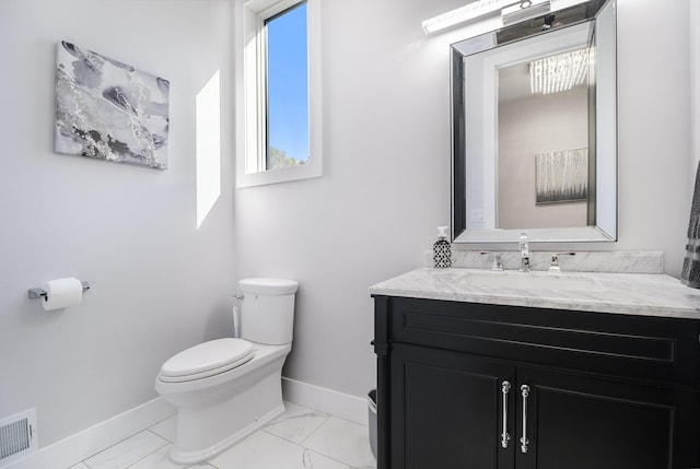 104 Highview Ct, Brooklyn, MI 49230 - bathroom featuring toilet, baseboards, vanity, and marble finish floors