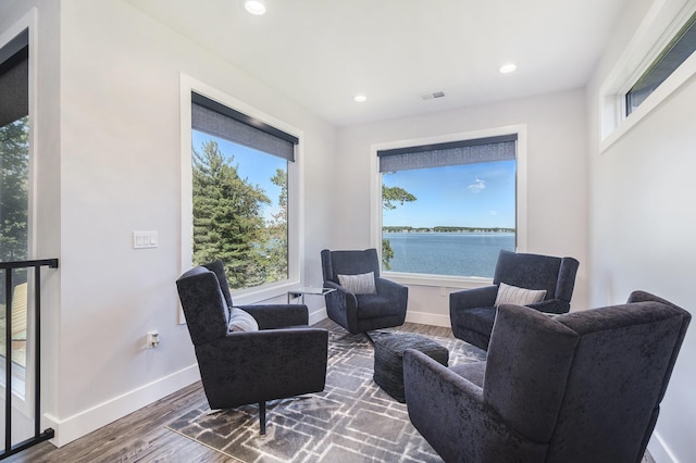 104 Highview Ct, Brooklyn, MI 49230 - sitting room featuring wood finished floors, baseboards, a water view, and recessed lighting