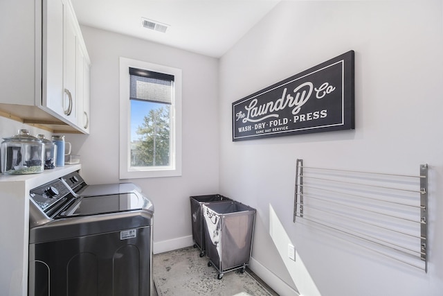 104 Highview Ct, Brooklyn, MI 49230 - washroom with washer and dryer, cabinet space, and baseboards