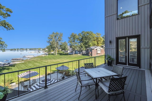 104 Highview Ct, Brooklyn, MI 49230 - deck featuring a water view, outdoor dining space, and a yard