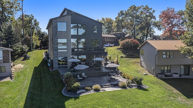 104 Highview Ct, Brooklyn, MI 49230 - back of house featuring a patio area and a lawn