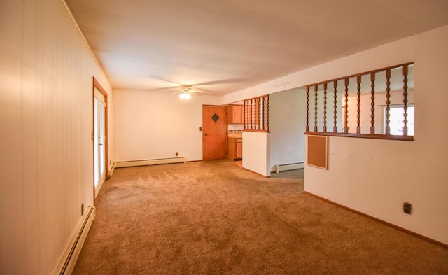 286 S Willowbrook Rd, Coldwater, MI 49036 - carpeted empty room featuring baseboard heating, a baseboard radiator, a ceiling fan, and baseboards