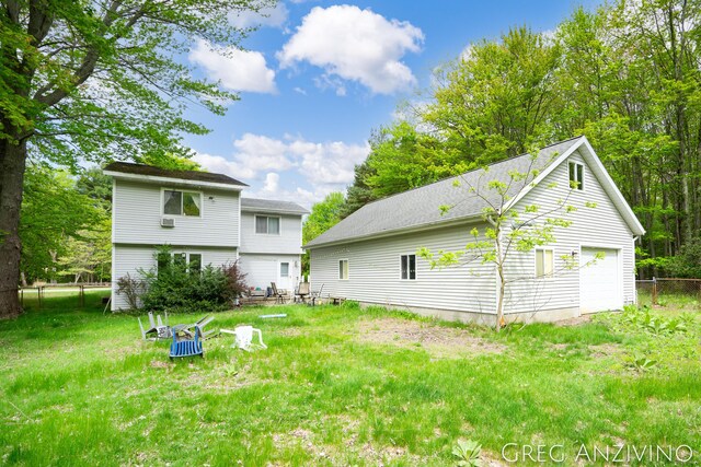 5906 Henry St, Norton Shores, MI 49441 - back of house with a garage