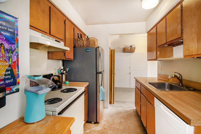 3146 Wolverine Dr, Ann Arbor, MI 48108 - kitchen with under cabinet range hood, white appliances, a sink, brown cabinets, and light countertops
