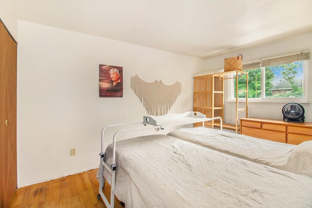 3146 Wolverine Dr, Ann Arbor, MI 48108 - bedroom featuring wood finished floors and baseboards