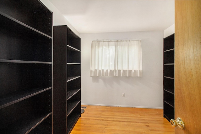 3146 Wolverine Dr, Ann Arbor, MI 48108 - walk in closet featuring wood finished floors