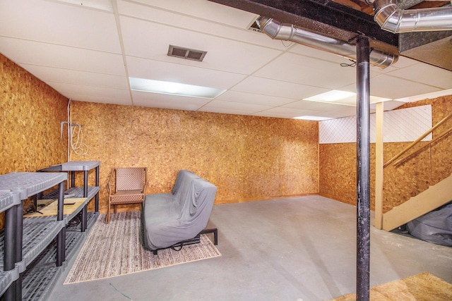 3146 Wolverine Dr, Ann Arbor, MI 48108 - sitting room featuring finished concrete floors and a drop ceiling
