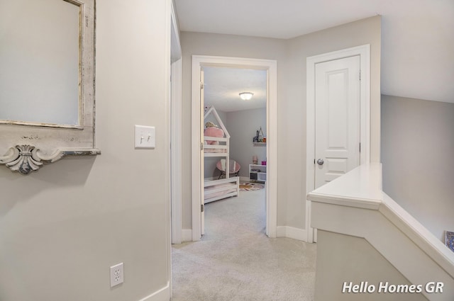 535 N Creek Ct NE, Rockford, MI 49341 - corridor featuring light colored carpet and baseboards