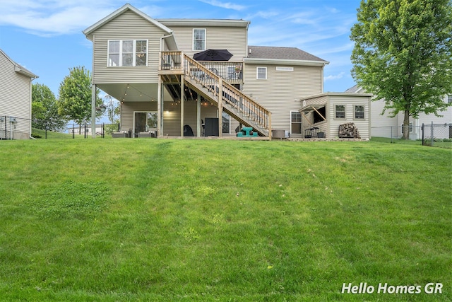 535 N Creek Ct NE, Rockford, MI 49341 - rear view of house featuring a wooden deck and stairway