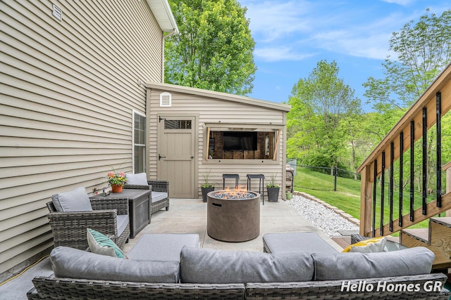 535 N Creek Ct NE, Rockford, MI 49341 - view of patio featuring an outdoor living space with a fire pit and an outbuilding