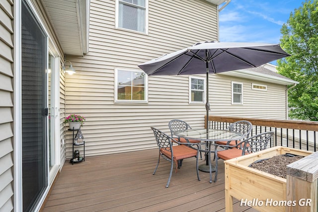 535 N Creek Ct NE, Rockford, MI 49341 - wooden terrace featuring outdoor dining area