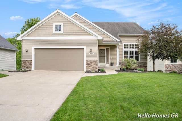 535 N Creek Ct NE, Rockford, MI 49341 - craftsman-style home featuring stone siding, concrete driveway, a front yard, and an attached garage
