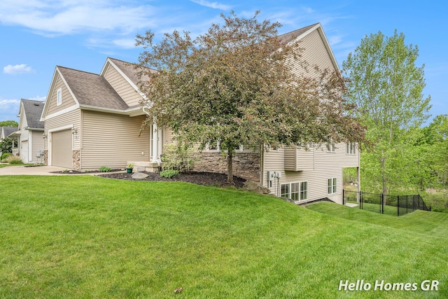 535 N Creek Ct NE, Rockford, MI 49341 - view of side of property featuring a shingled roof, concrete driveway, and stone siding