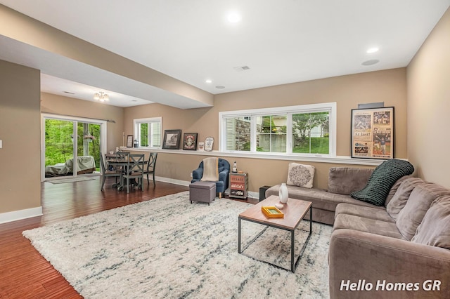 535 N Creek Ct NE, Rockford, MI 49341 - living area featuring baseboards, wood finished floors, and recessed lighting