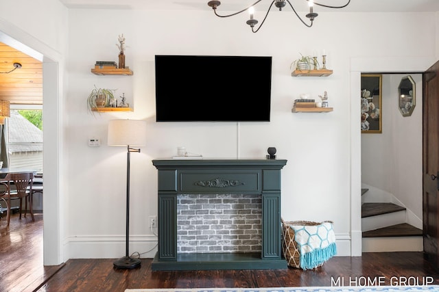 44 Taft St, Zeeland, MI 49464 - living area featuring wood finished floors, stairway, a fireplace, a chandelier, and baseboards