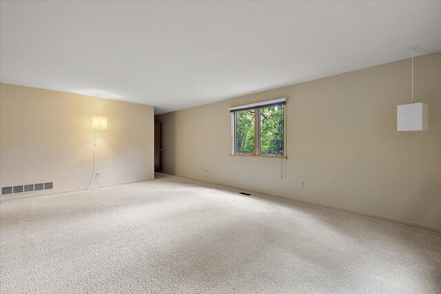 2 Eastbury Ct, Ann Arbor, MI 48105 - carpeted spare room featuring baseboards