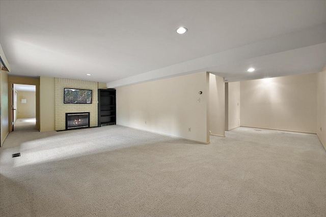 2 Eastbury Ct, Ann Arbor, MI 48105 - unfurnished living room featuring a brick fireplace, light carpet, recessed lighting, and baseboards