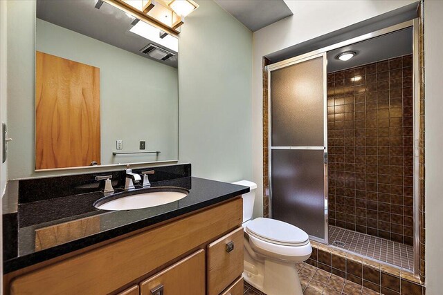 2 Eastbury Ct, Ann Arbor, MI 48105 - full bath with toilet, vanity, a shower stall, and tile patterned floors
