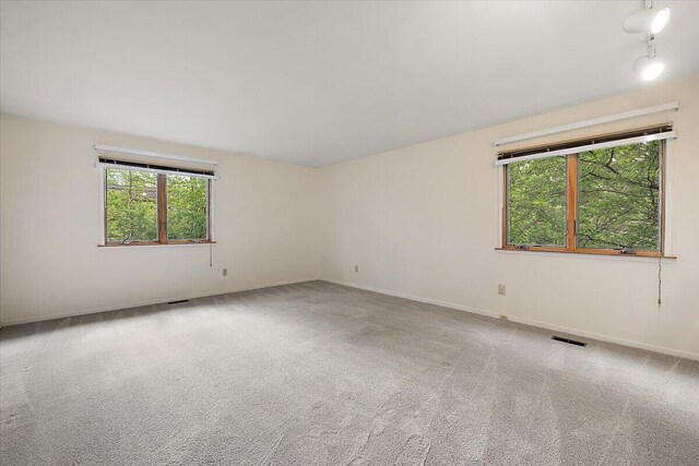 2 Eastbury Ct, Ann Arbor, MI 48105 - carpeted spare room featuring baseboards