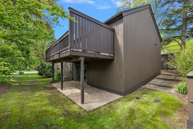 2 Eastbury Ct, Ann Arbor, MI 48105 - rear view of property with a lawn, a patio area, a deck, and central AC unit