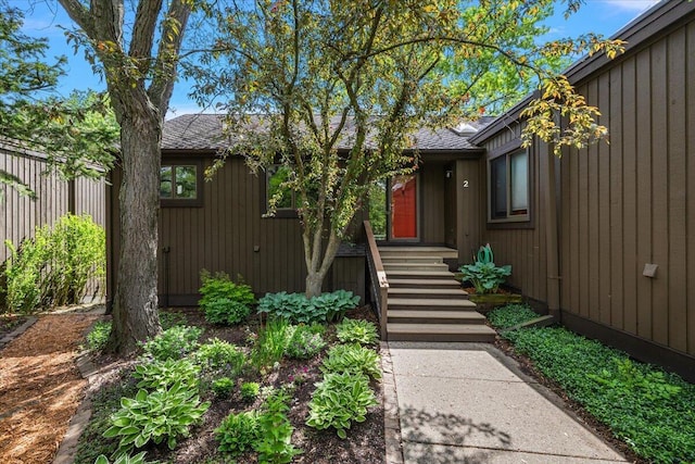2 Eastbury Ct, Ann Arbor, MI 48105 - doorway to property featuring a shingled roof