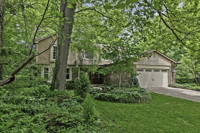 14436 Fairway St, Livonia, MI 48154 - view of front of property with concrete driveway, a garage, a front yard, and brick siding