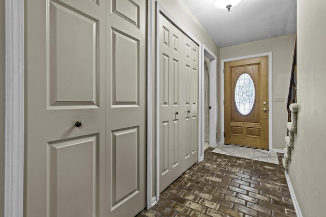14436 Fairway St, Livonia, MI 48154 - doorway to outside featuring baseboards and brick flooring