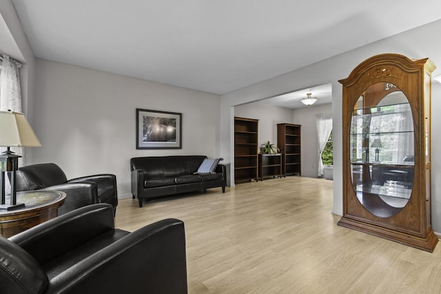 14436 Fairway St, Livonia, MI 48154 - living room with light wood-style flooring and baseboards
