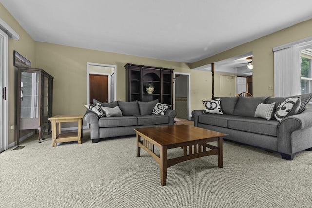 14436 Fairway St, Livonia, MI 48154 - living area with light carpet and a ceiling fan