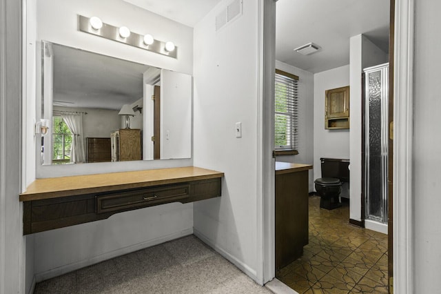 14436 Fairway St, Livonia, MI 48154 - bathroom with toilet, vanity, a shower stall, and baseboards