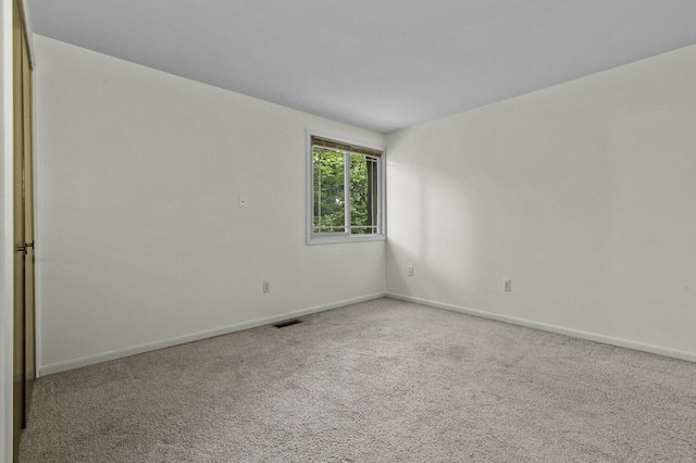 14436 Fairway St, Livonia, MI 48154 - carpeted empty room with baseboards