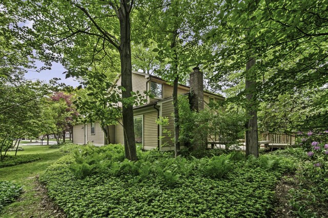 14436 Fairway St, Livonia, MI 48154 - view of property exterior featuring a chimney