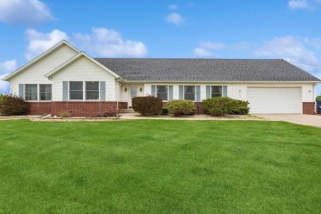 3025 Shawnee Rd, Bridgman, MI 49106 - single story home with brick siding, a garage, concrete driveway, and a front lawn