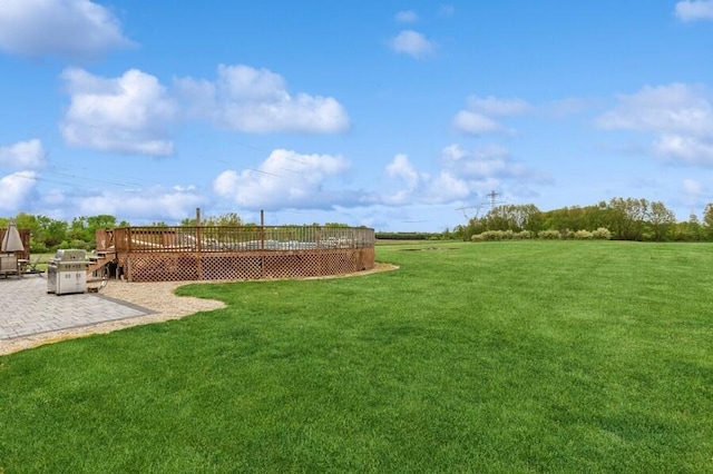3025 Shawnee Rd, Bridgman, MI 49106 - view of green lawn featuring a deck and a patio