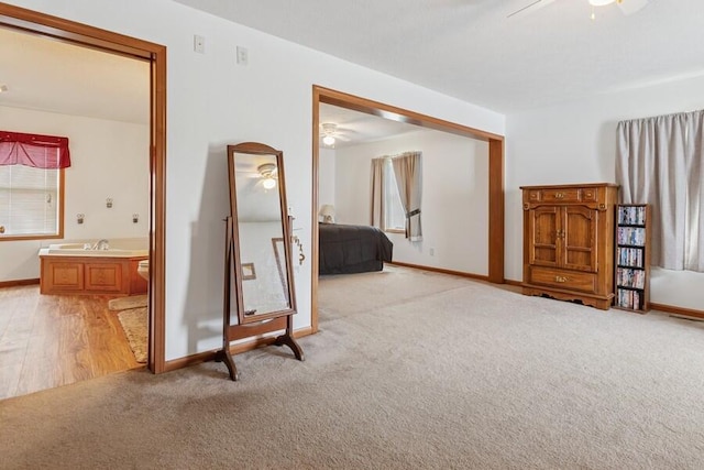 3025 Shawnee Rd, Bridgman, MI 49106 - bedroom featuring light colored carpet, baseboards, a closet, and ensuite bathroom