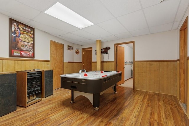 3025 Shawnee Rd, Bridgman, MI 49106 - game room featuring wainscoting, a paneled ceiling, wood finished floors, wood walls, and beverage cooler