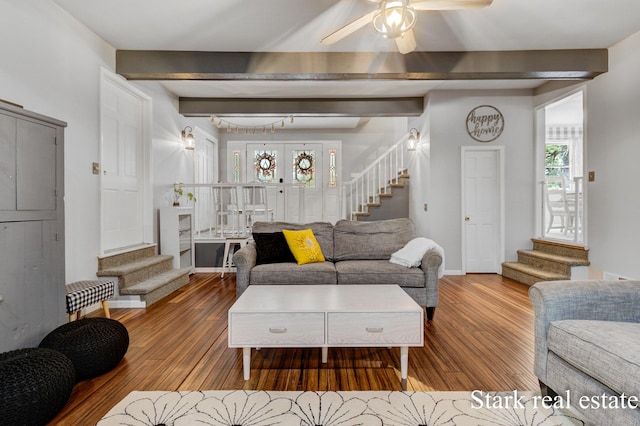 300 N 2nd Ave, Fruitport, MI 49415 - living room featuring stairs, wood finished floors, ceiling fan, beam ceiling, and baseboards