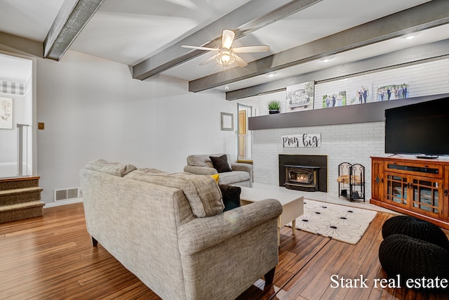300 N 2nd Ave, Fruitport, MI 49415 - living area featuring wood-type flooring, beam ceiling, ceiling fan, and baseboards