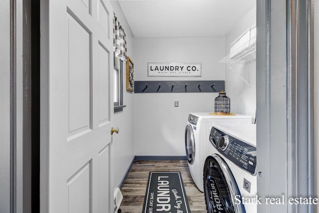300 N 2nd Ave, Fruitport, MI 49415 - laundry room with washer and dryer, wood finished floors, and baseboards