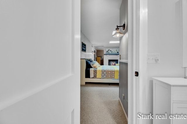 300 N 2nd Ave, Fruitport, MI 49415 - bedroom with carpet, a brick fireplace, and baseboards