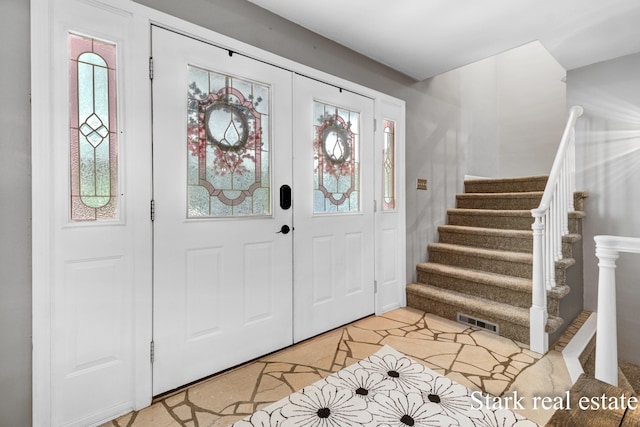 300 N 2nd Ave, Fruitport, MI 49415 - entryway featuring healthy amount of natural light and stairway