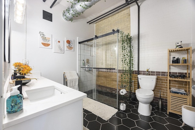 600 Broadway Ave NW Unit 117, Grand Rapids, MI 49504 - bathroom with toilet, vanity, a shower stall, and tile patterned floors