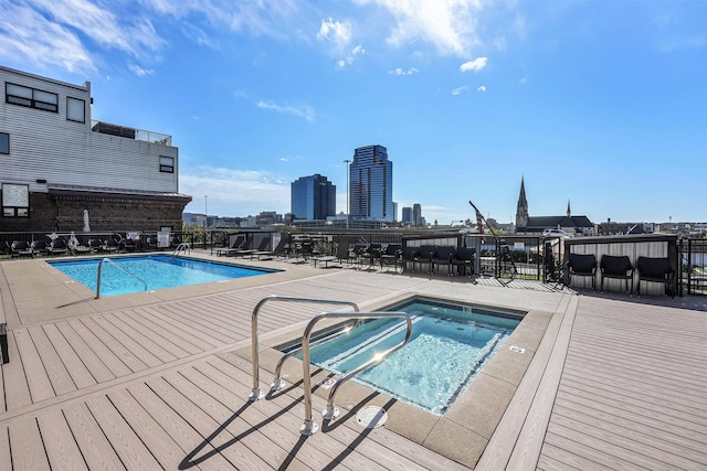 600 Broadway Ave NW Unit 117, Grand Rapids, MI 49504 - community pool featuring a community hot tub and a patio