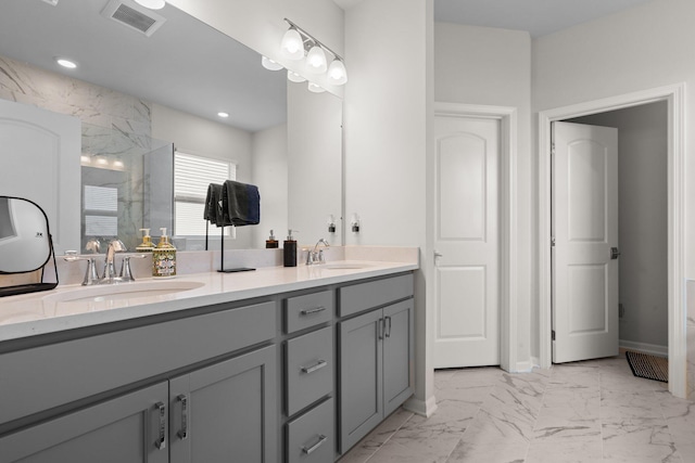 2771 Silo Dr, Saline, MI 48176 - full bath featuring double vanity, marble look tile flooring, walk in shower, recessed lighting, and baseboards