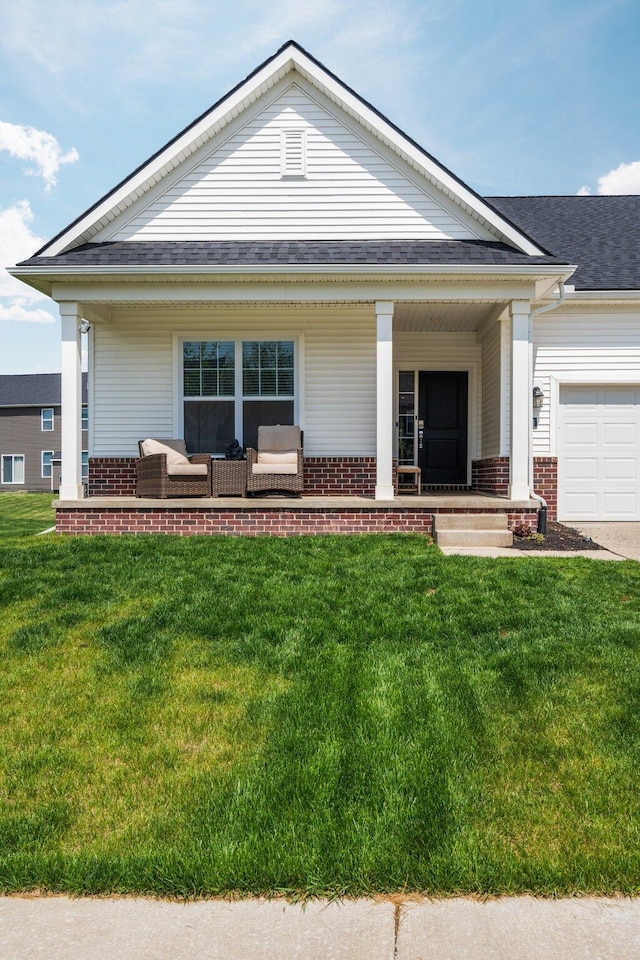 2771 Silo Dr, Saline, MI 48176 - view of front of property with a porch, brick siding, and a front lawn