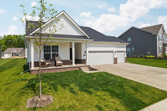 2771 Silo Dr, Saline, MI 48176 - view of front of home with a porch, a garage, driveway, and a front yard