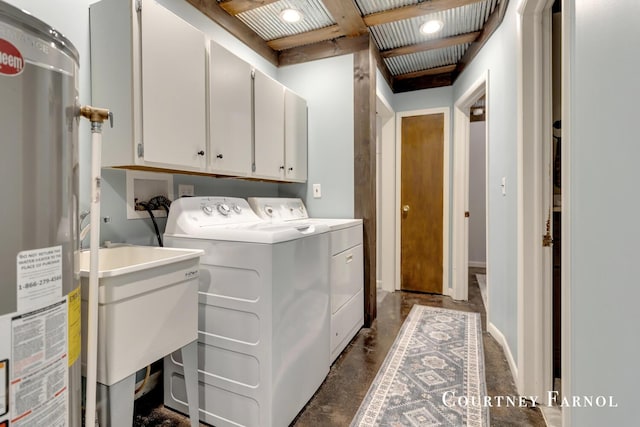 414 135th Ave, Wayland, MI 49348 - laundry area featuring water heater, independent washer and dryer, and cabinet space