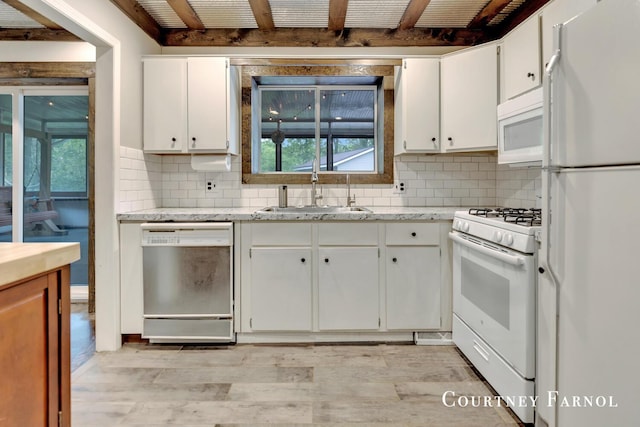 414 135th Ave, Wayland, MI 49348 - kitchen with white appliances, a sink, white cabinets, decorative backsplash, and beamed ceiling